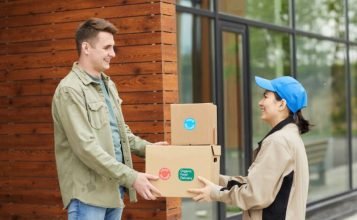 man-getting-parcels-from-courier-2021-08-28-12-44-32-utc-1-800x534